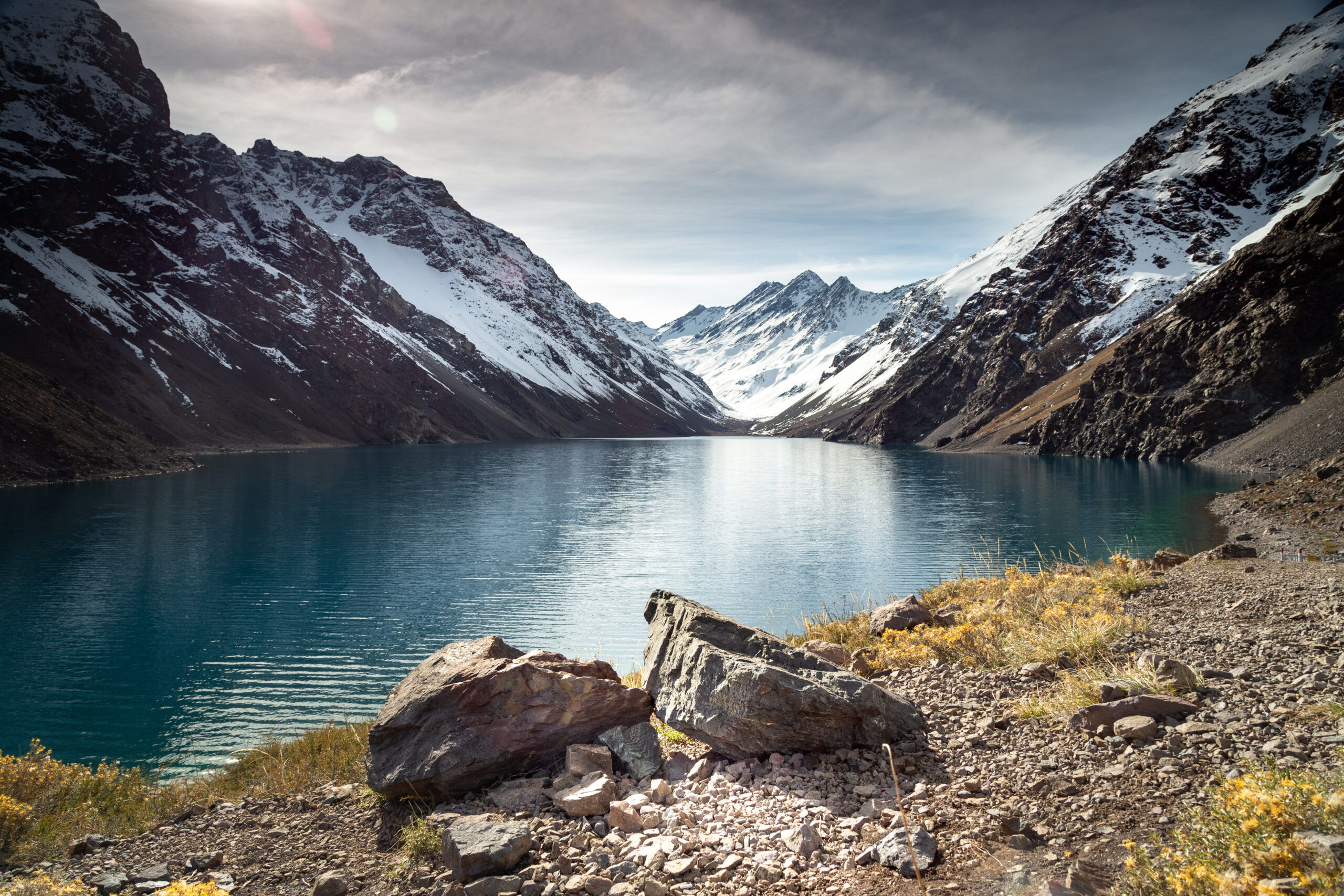 laguna-del-inca-lake-surrounded-by-high-mountains-covered-snow-chile-1-scaled.jpg