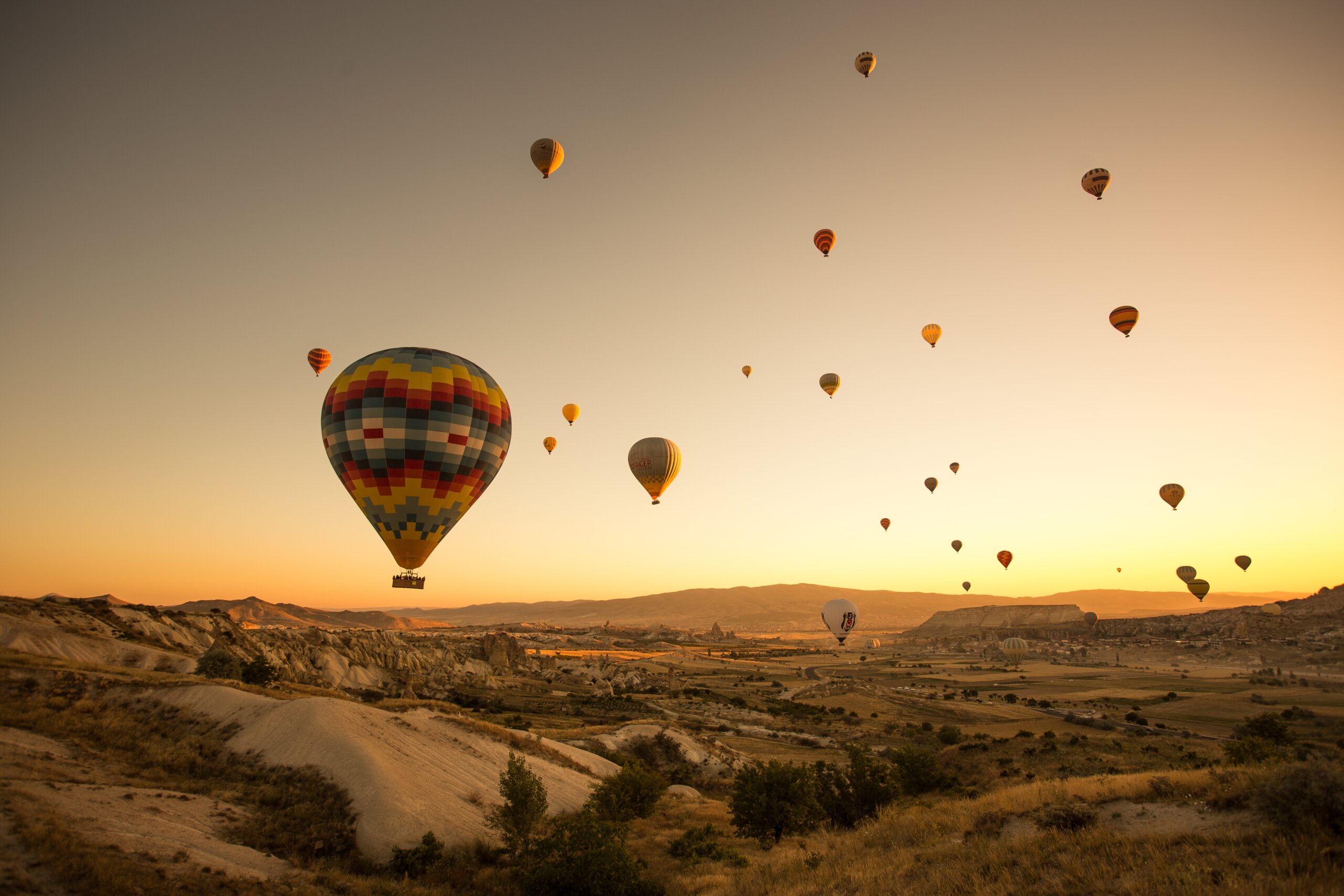 set-colored-balloons-flying-ground-cappadocia-turkey-scaled.jpg